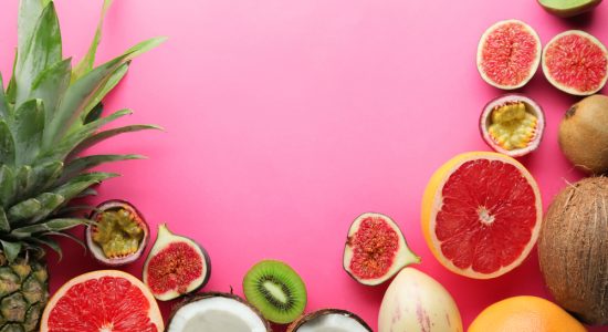 Summer composition with tropical fruits on color background